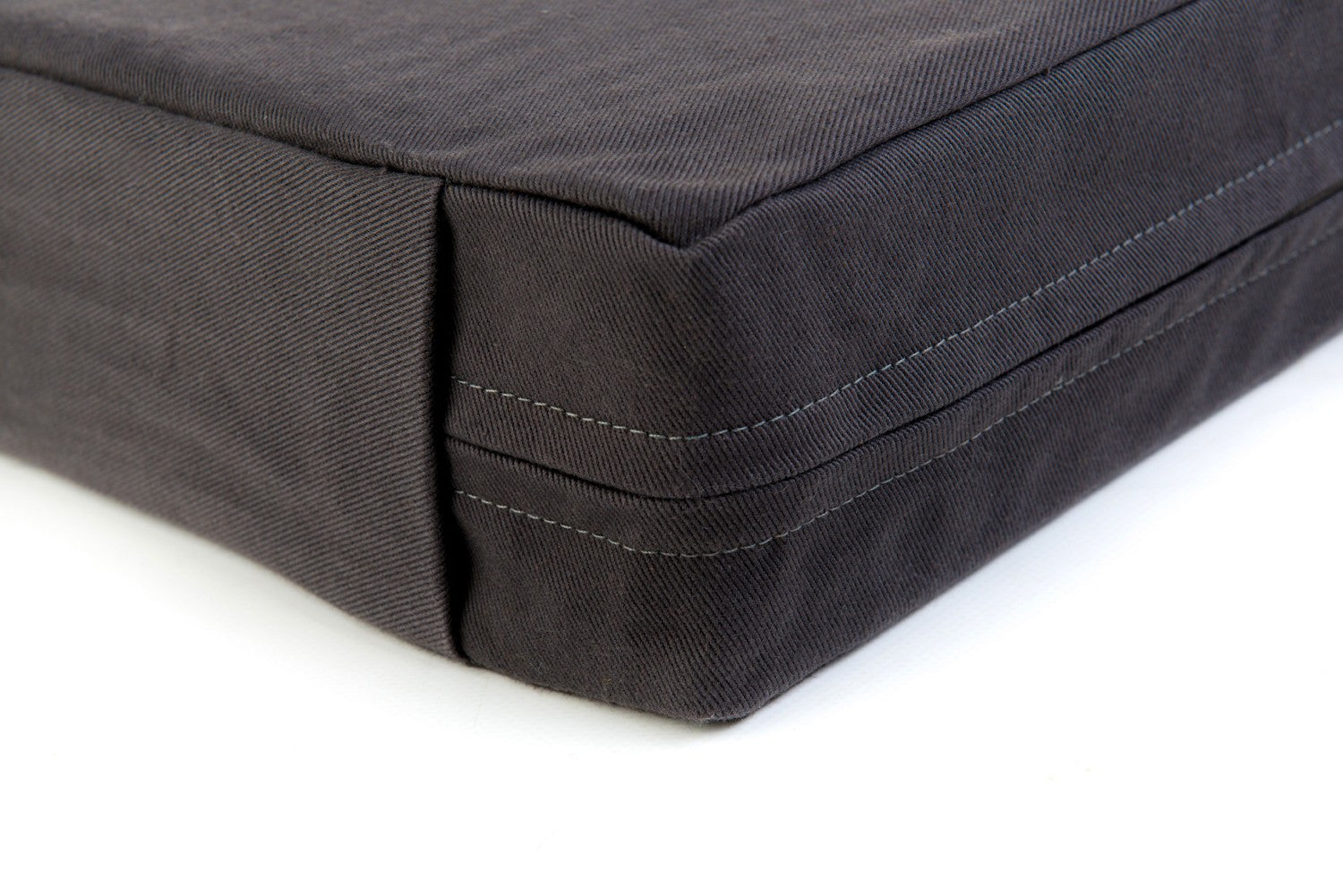 Float orthopaedic heated waterbed in charcoal cotton for dogs made in Britain from organic materials. 