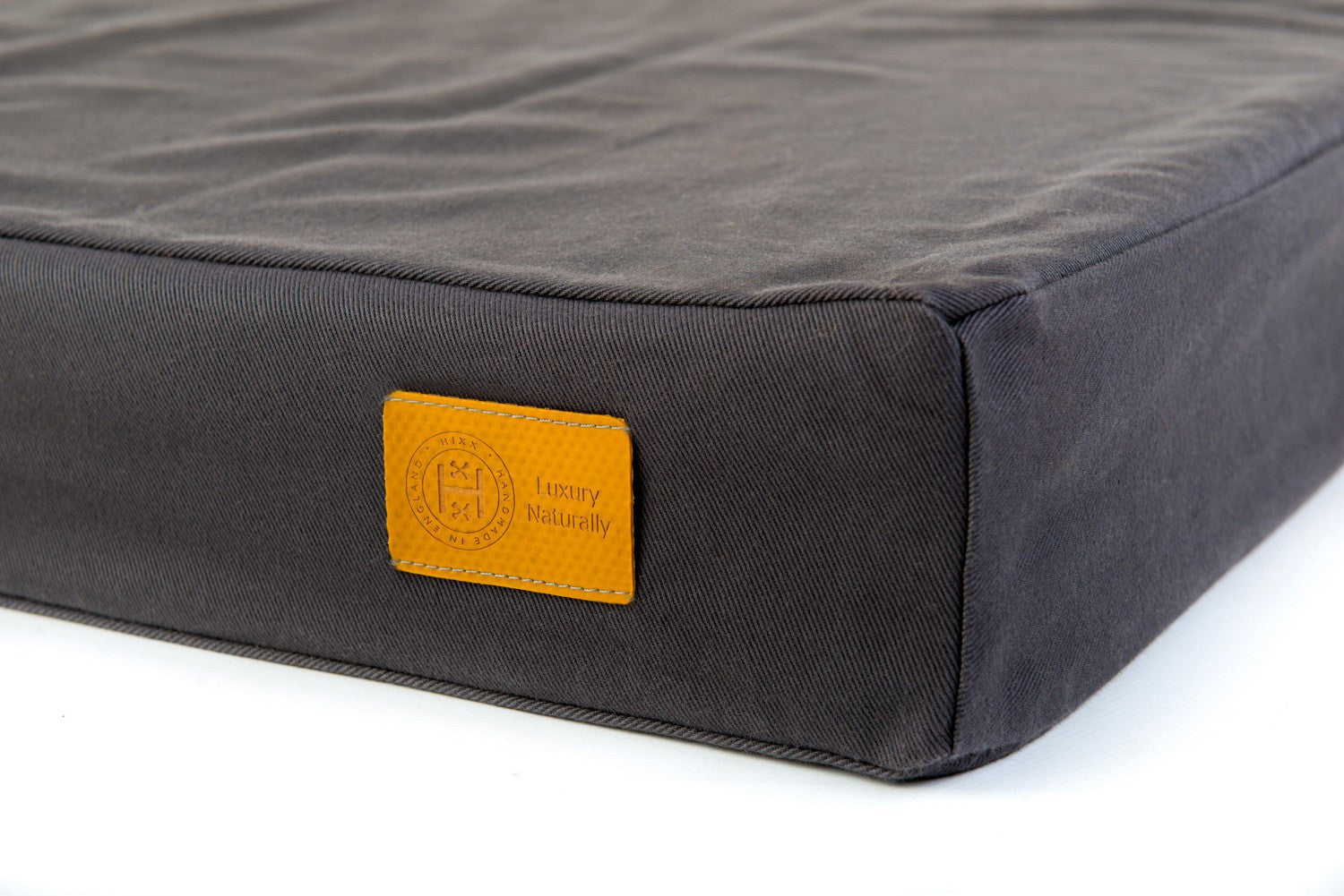 Float orthopaedic waterbed in charcoal cotton for dogs made in Britain from organic materials. 