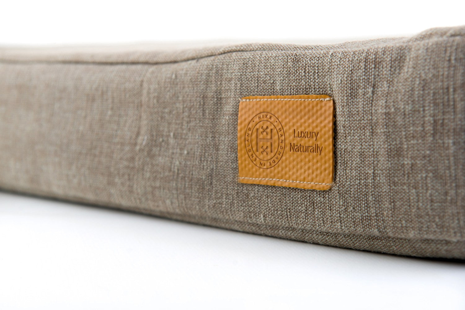 Front corner of Organic Olive Cotton Wild Rover natural dog bed from Hixx