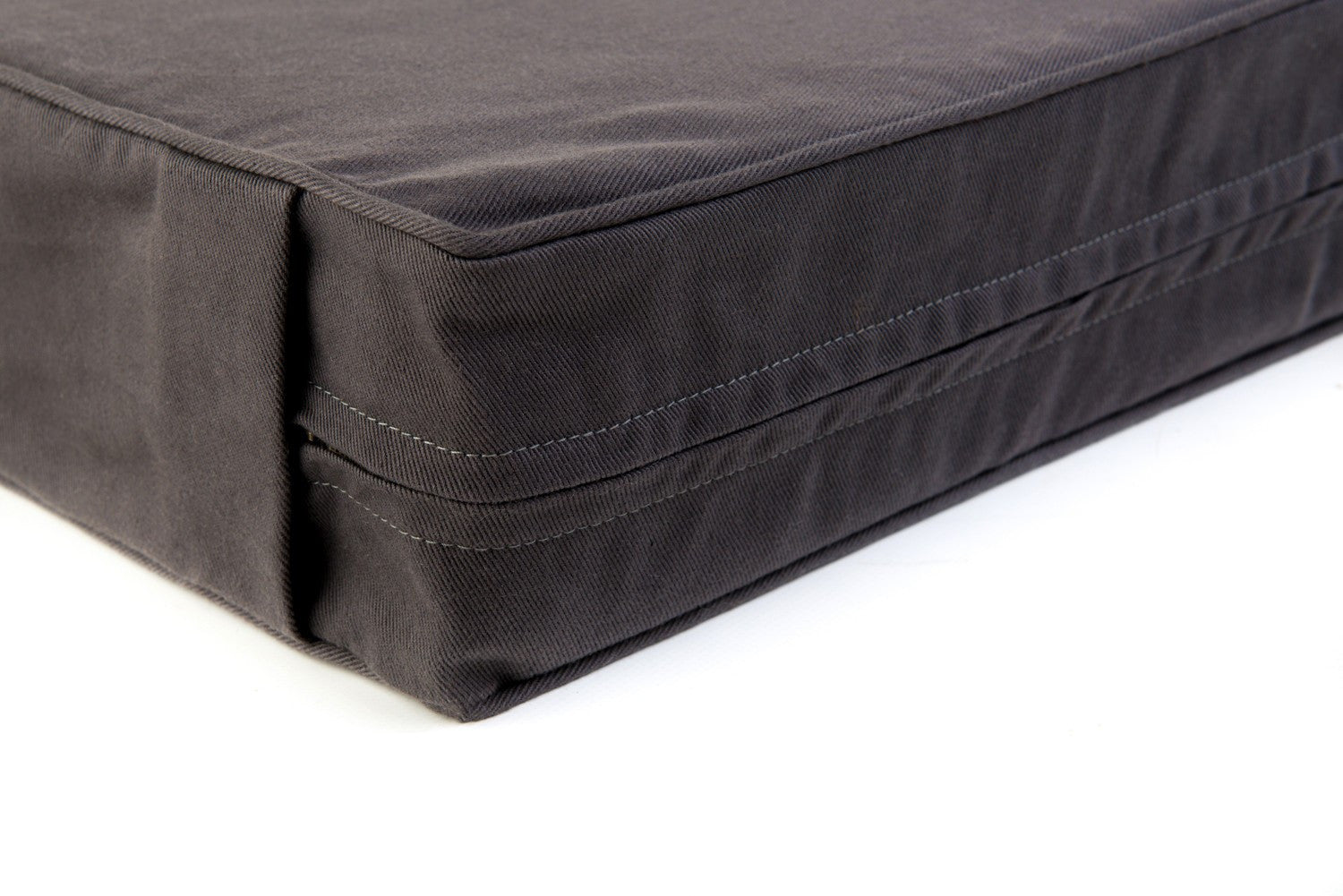 Corner of Hixx Classic charcoal bull denim cotton luxury bed for dogs. Made in Britain from organic materials.