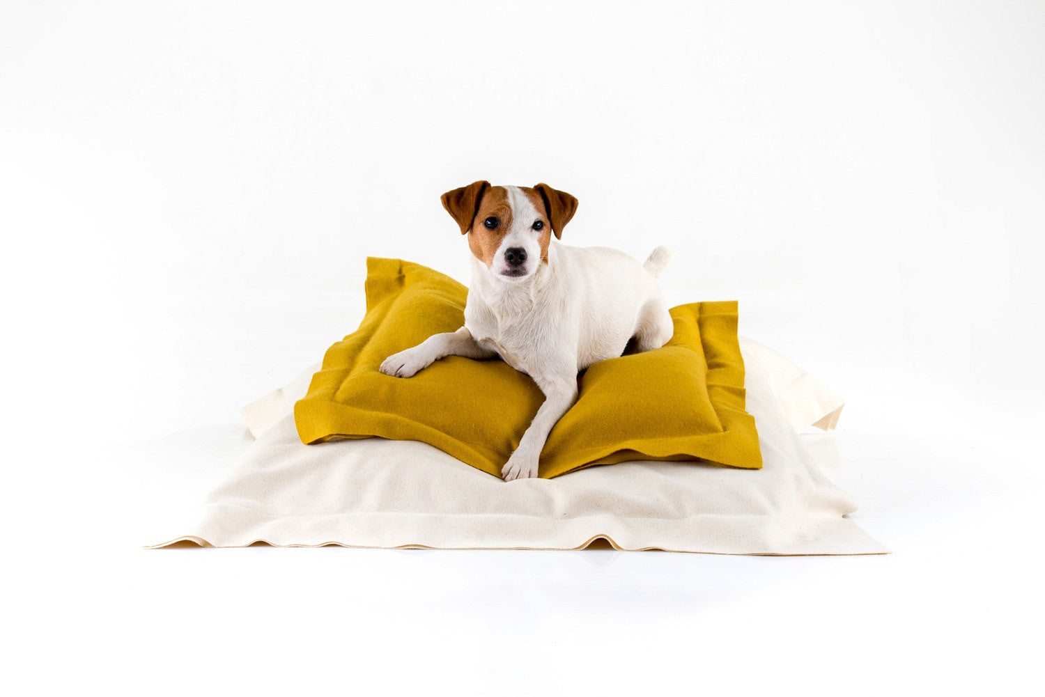 Stack of British Melton Wool duck down filled cushions.