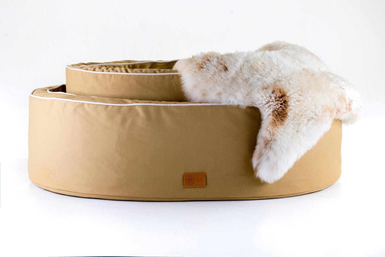 Sand and cream bull denim cotton natural Nest dog bed made from organic materials. British sheepskin addition. 